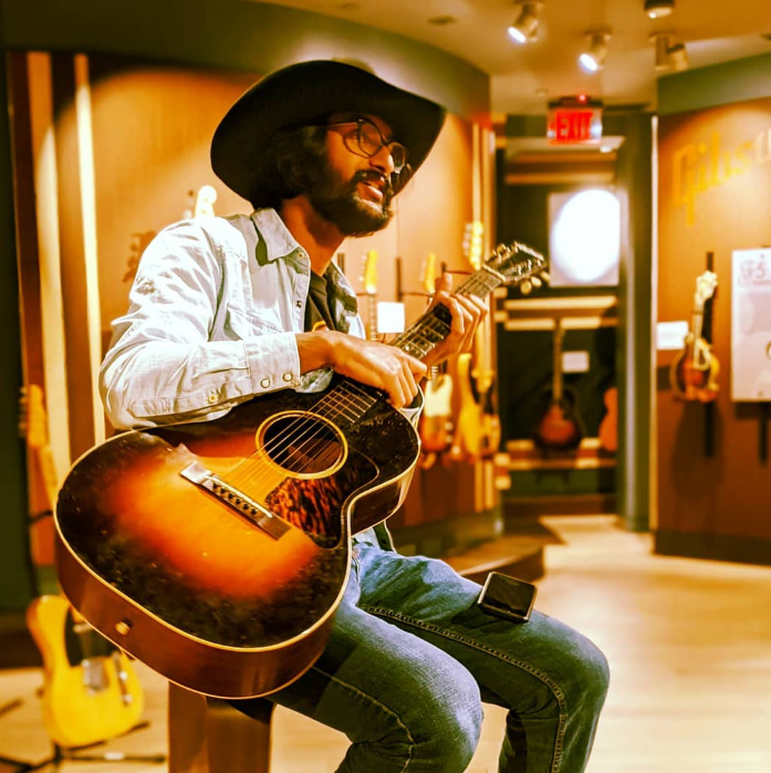 Bishwaa Ramakrishnan playing guitar